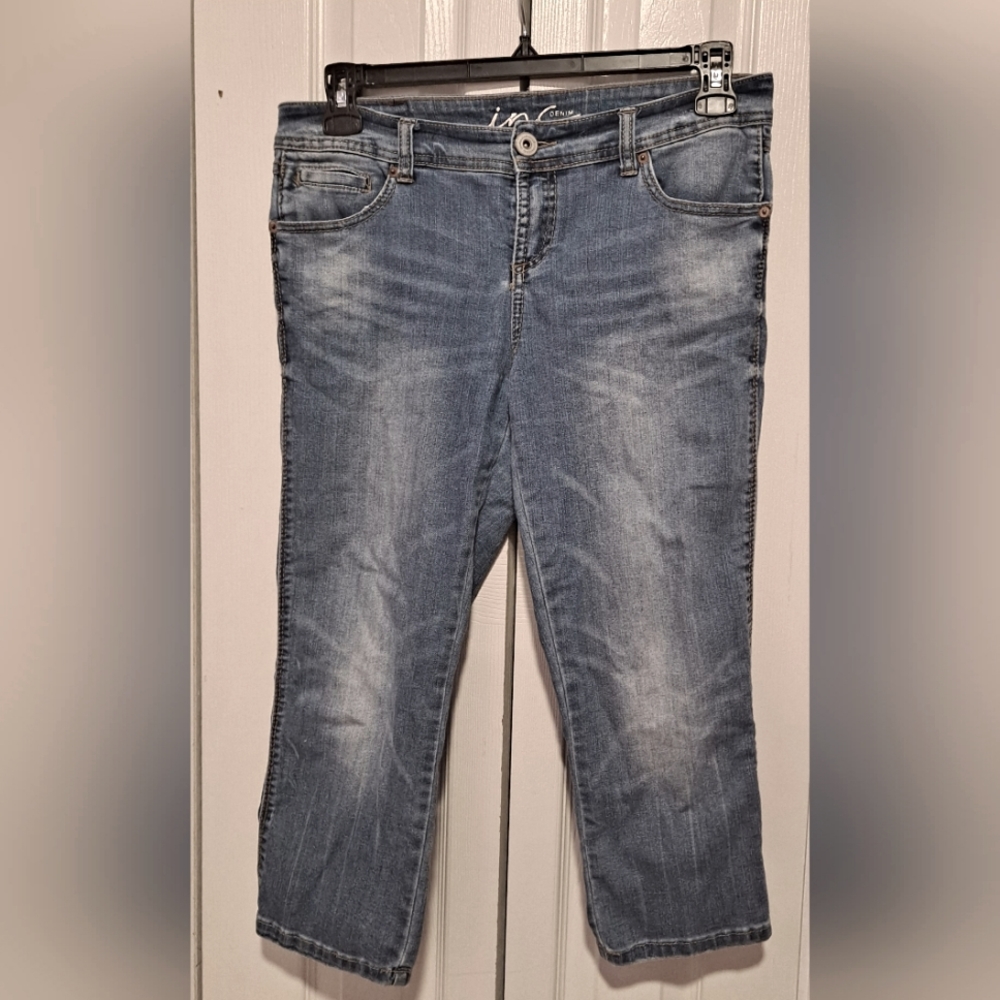 Blue jeans with brown stitches and four non-fake pockets